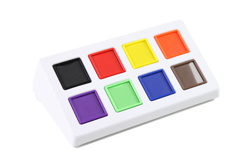 A flat rectangular communicator with a grid of eight large square message buttons, each holding a picture icon.