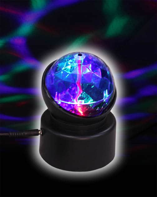 A small clear dome on a base that projects colorful kaleidoscopic light patterns.