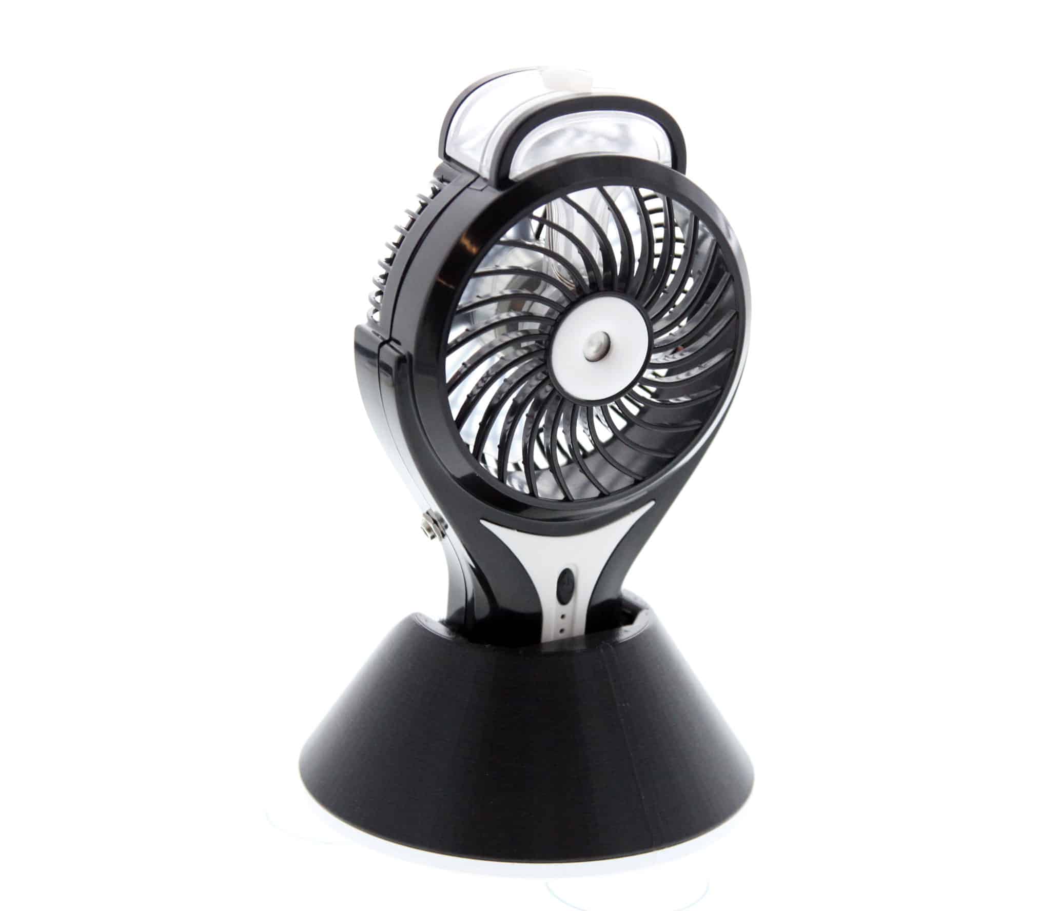 A small portable fan with a misting nozzle on a base with suction cups.