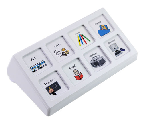 A flat rectangular eight-button communicator with a level-selector dial, the square buttons holding colorful picture icons.