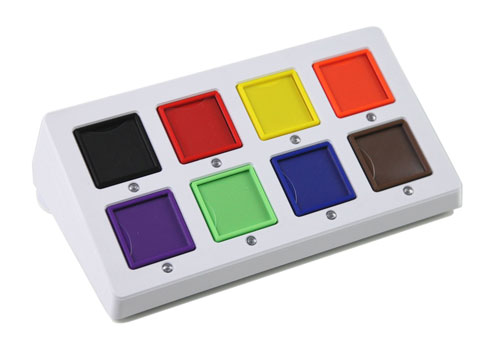 A flat rectangular eight-square communicator with indicator lights under each square and switch jacks along the side for scanning access.