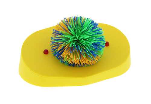 A round switch toy covered in soft, spiky rubber koosh strands, with a connection port for switch-enabled devices.