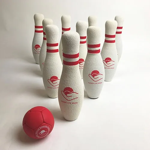 Ten white foam bowling pins with red stripes and a soft red ball.
