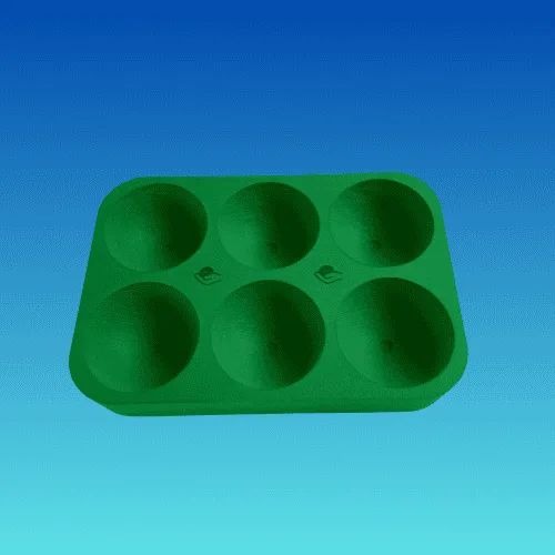 A green foam boccia tray with six round recesses for balls.