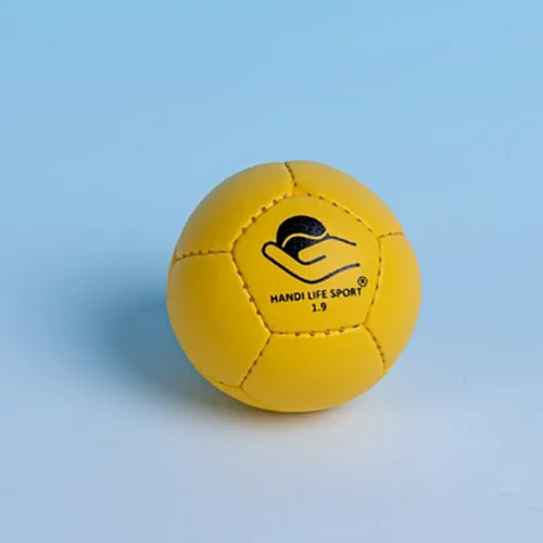 A single soft yellow handsewn crolf ball with the Handi Life Sport logo.