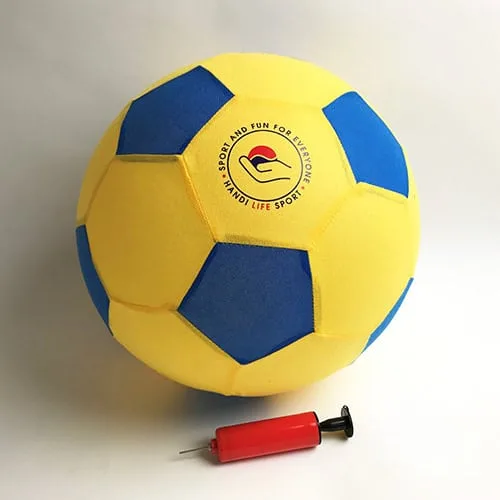 A soft yellow and blue ball with a red ball pump beside it.
