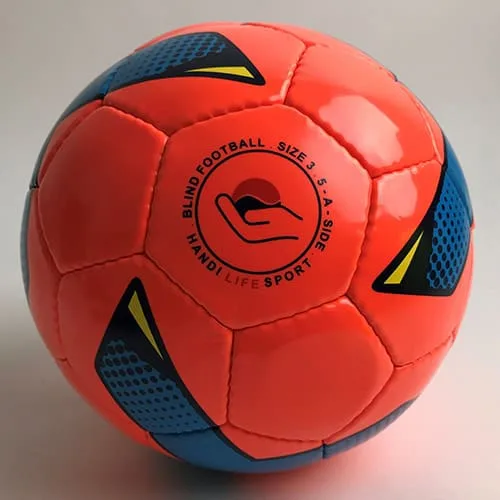 A bright orange blind football with blue and yellow accents and a sound-device pattern.