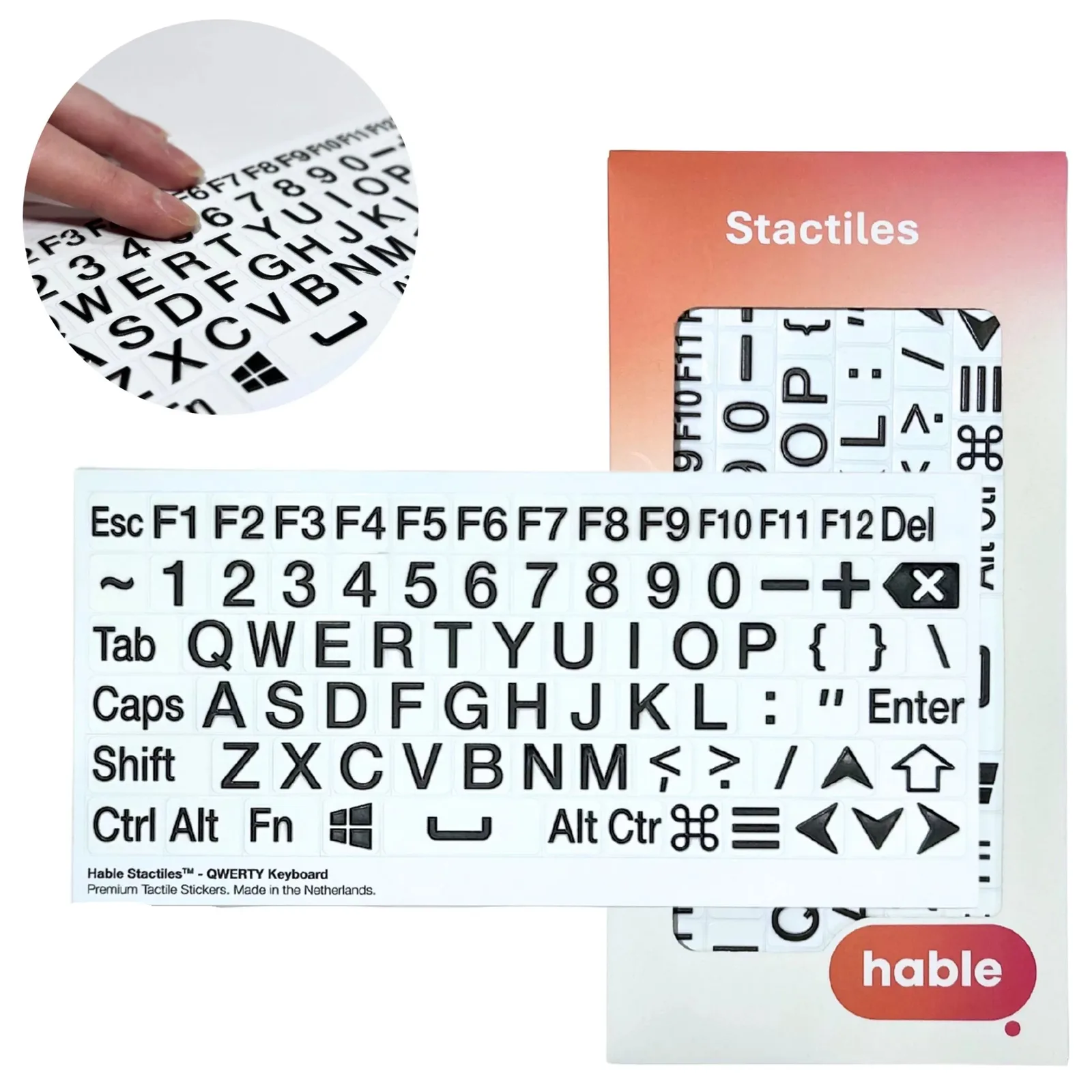 The Hable Stactiles QWERTY Keyboard set: a white sheet of bold black-on-white key stickers covering a full keyboard, Esc and F1 to F12, the number row, the QWERTY letters, modifier keys and arrows, shown in front of its orange Hable box. An inset close-up shows a fingertip feeling the raised keys.