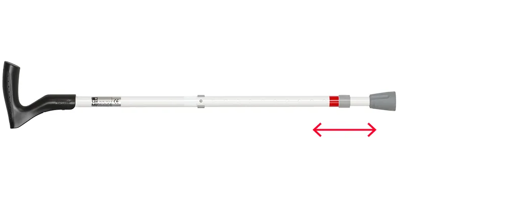 Straight telescopic white support cane: black orthopedic handle, adjustment collar mid-shaft, red band with double arrow, grey rubber tip.