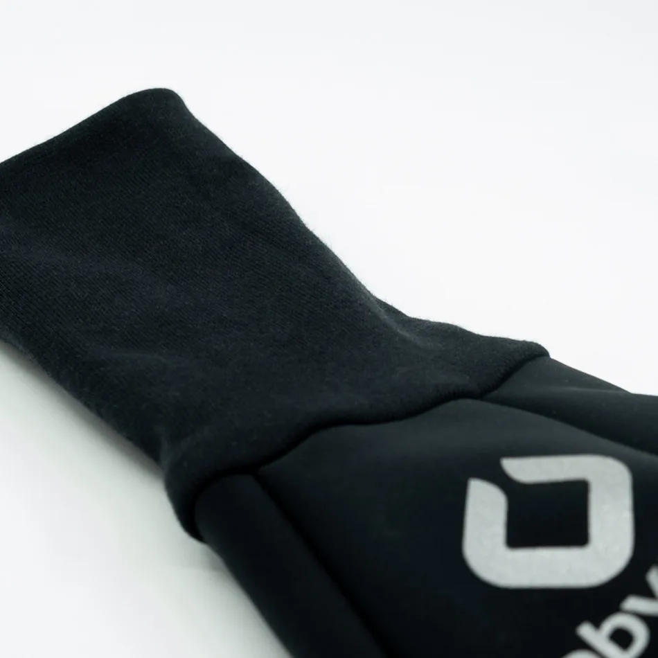 The MUFF long-cane hand warmer: a black softshell tube with a ribbed cotton cuff and a drawstring toggle at one end.